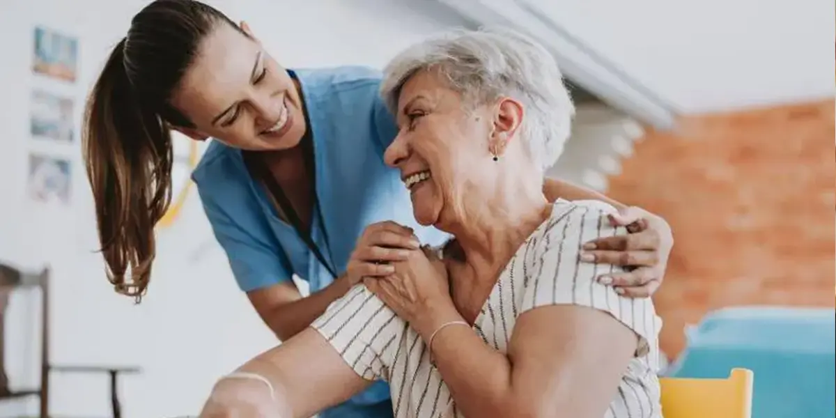 Elderly woman receiving Mental Health Support from a caring healthcare worker