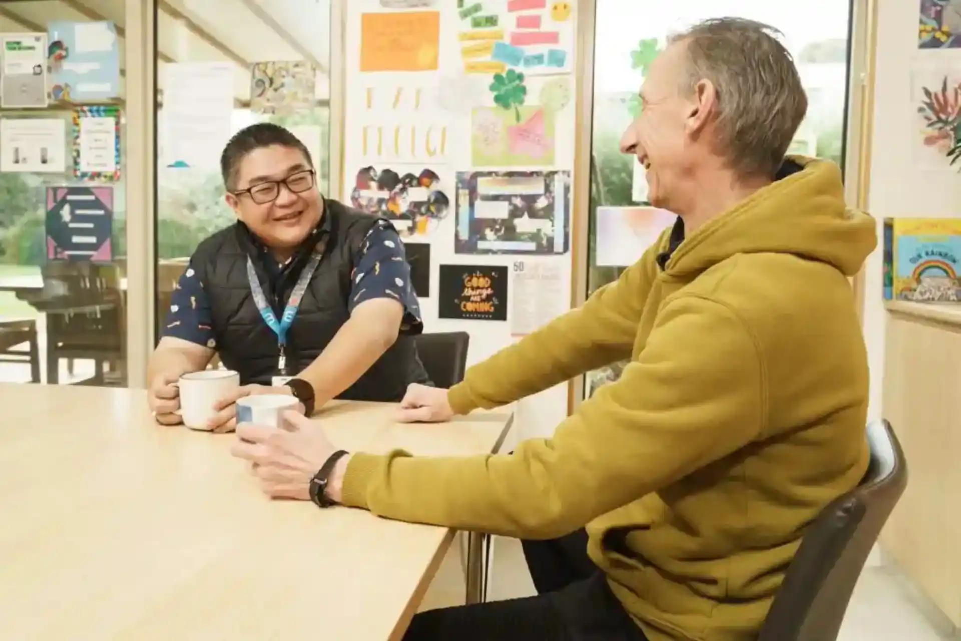 Support workers guiding participants through daily tasks for Psychosocial Recovery support.
